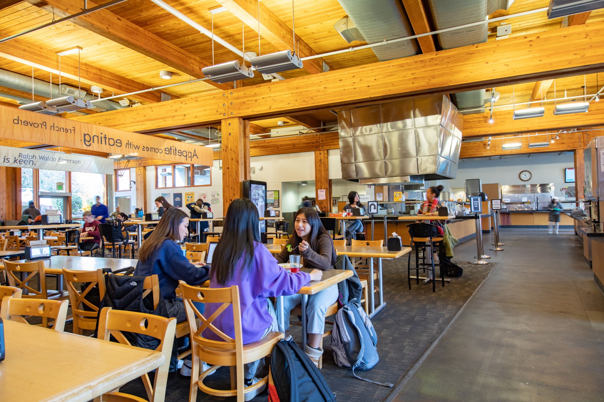 Students sharing a meal in Gwinn Commons at Seattle Pacific University